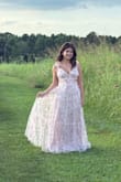 Beautiful pink toile dress. I did have to alter the straps (they were too long, even on the tightest setting) and hem the bottom as the dress was too long even with 3-inch heels. However, it was beautiful after these alterations! - Natalie N.