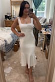 SO pleased with this purchase. It's exactly what I expected. Hugs very nicely, super flattering. The liner inside is thick enough that it's not see-through, which is great. I'm wearing sticky boobs with it. I love the length and the square neck. I'm planning to wear this for my wedding rehearsal dinner. - Jillian P.