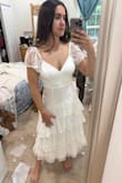 I was going to wear this for the rehearsal dinner, but I think I'll save it for the honeymoon instead because the chest area is a little too exposed for my liking. But I love this dress it's so pretty, and the sleeves are cute. Overall quality is cheap-ish, but I was expecting that and am pleased with this purchase. - Jillian P.