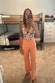 Such a fun floral pattern. Colors are vibrant. In between a small and xs but ordered s because I am tall. Only complaint is that only one of the snaps works. - Leia R.