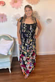 Wore this as a guest to my best friend's wedding and I've never received so many compliments in my life!! I felt so beautiful. Ordered my normal size for Lulus XL, and it fit perfectly. I don't like my clothes too snug, and this felt like the perfect amount of give, so I could sit and eat dinner and dance. Some flowers came a bit creased from shipping, but they steamed out. The material was a little heavier than expected, but in a good way. Still, I was worried it might be too hot for a summer wedding, but since the reception was inside, I never felt too hot at any point. Chafe shorts helped too! Definitely plan to have a friend tie the straps tight for you so they won't budge. Danced all night, and it was very comfortable. I truly didn't want to take it off once I got home! - Allison F.