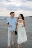 This dress was perfect for our beach engagement shoot. It fit like a glove, and I didn't need a bra or cups. The top is form-fitting, while the bottom flows beautifully. The neck scarf was the perfect finishing touch! - Emily C.