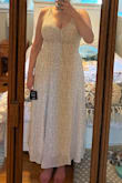 Sizing is good, I wouldn't size up, but I have a larger bust, and it's a little difficult to get on with not a ton of stretch/no zipper. If you're worried about your bust fitting, I would size up. Once it is on, though, love the fit of it. Solid fabric, not see-through. Really happy with this, wearing it to a shower! - Maggie J.