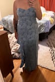 Ordered a M, it fit but a little too snug. When I sat, I felt uncomfortable. The L was perfect. Fit like a glove still and comfortable to sit and move. The pic was the medium, loved it still. Just like I said above, a tad too restrictive for sitting. - Kristin N.