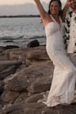It was perfect for my small intimate beach wedding. I ordered a size up and had it tailored. - Raylene G.