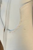 Chuck of the leather missing, and appears to have peanut butter smeared and stains on it - Abby G.