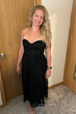 The dress is lovely! Fit is good and very comfortable. The smocking on the back provides some extra room on the top. If small chested think about going down a size. - Shanna H.