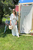 Wore this dreamy top to my bridal shower, which had an Italian market / European summer theme, and it fit the vibe perfectly. The fabric is lightweight and pleated in all the right ways, giving it that breezy, easy glamour you'd expect strolling through a lemon grove or sipping spritzes on the Amalfi coast. It fit loosely on my frame (small bust), but I loved the relaxed silhouette; it felt romantic, graceful, and super comfortable all day. I wouldn't change the size. It's effortless, flattering, and feels made for summer celebrations under the sun. - Jamie P.