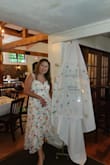 I wore this to my bridal shower! Got a lot of compliments. Very sweet and romantic looking! I tried the Large, it fits me, but a little too snug for my liking. The XL was a little loose, but fits me comfortably, wouldn't change a thing - Gem G.