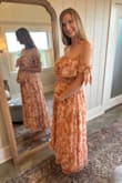I got this dress for my brother's summer wedding. A small fits perfectly with my little baby bump. The dress was very comfortable and flattering. It has a gold shine to it that I didn't notice in the picture. It's beautiful and comfortable! - Liz D.