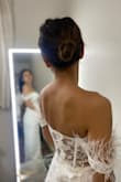 The dress is beautiful and stunning. I might trim the feathers. - Elita A.
