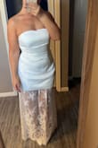 I bought this for my wedding rehearsal dinner and it is absolutely stunning, but sadly I'll be returning it. I'd say it fits pretty true to size, but the length is a challenge. I'm fairly tall at 5'8, and in this photo I'm wearing 3.25-inch heels, yet it's still very long and skims the floor. Just something to keep in mind depending on your height and heel height! - Delilah K.