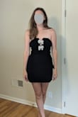 I ended up choosing a different option for my event, but this was a HIGH contender. It fits true to size, has boning in the bust/torso to keep the structure, and has the most flattering shape. The beaded bows are adjustable/moldable, and it is overall CUTE. Would definitely recommend! - Amanda B.
