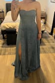 This dress looked so cute online and fit almost perfectly. However, the silicone across the top of the bust provided no support for the dress, and it slipped down when I raised my arms up. Will be returning. - Celeste M.