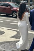 I love this dress. It was exactly what I was looking for. Simple but still elegant. I wore it to my courthouse wedding. I would've loved to have had the chance to try on the medium. I believe it would've fit me better. But it was a last minute purchase and thanks to Lulus expediting shipping, actually being accurate (unlike many other online stores) I was able to get it the day before my wedding! And it was perfect. P.s I did get it hemmed. - Amanda V.