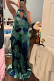 I sized down to a small after reading reviews before purchasing. It is still so comically long. I'll either have to return it or see if it can be altered/cut in any way. There's no way I could wear this even with 2-3 inch heels on you're tripping over it. - Keely W.