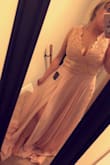 I am very pleased with this dress. I ordered a medium based off of the size measurement chart. I am really short so I will need to get it hemmed and altered slightly because my torso is shorter. I wish It had a built in bra but that could easily be put in when altered. It's a gorgeous well made dress! - Alexis A.