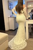 El vestido es igual a las fotografías. Es hermoso. Ame el encaje. - Karen