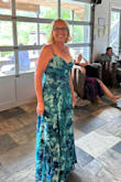 I purchased this dress for my daughter's wedding, and it was really so pretty!  It didn't need to be steamed, although we traveled a long way.  Seems ike the kind of dress you could throw in a suitcase and it would look great when you pulled it out.   It was a little snug around my ribs but not so tight to be uncomfortable.  I loved the vibrant colors, and the length was perfect.  Probably not durable enough to wash & wear again. - Jenni L.