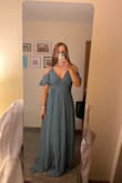 Super flattering dress, very comfortable, and color is great! The top fits a little loose, so be cognizant of that. The slit was nice (but can be dangerous if it's windy!). (First photo - out of the package, second photo - hemmed) - Karissa G.