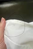 When I opened the package, this dress had an imperfection sewn in the dress. There is a dark spot in between the fabric near the armpit area that cannot be reached to clean or remove. I hope to get a refund. - Anna S.