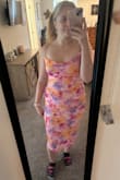 I got so many compliments on this dress!! I am not sure if it was because I'm not a busty girlie, but the top was loose enough that I was worried about slipping out! It held true throughout the night though! This dress does run very large in my opinion, and I feel like I could've sized down and been completely okay! I adjusted the little opening on the side to make it fit just right for me, but the material is SO stretchy!! It is so beautiful though! - Tara W.