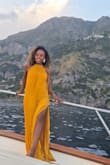 The dress is super long, but it worked out well for a shoeless photoshoot I was doing. It turned out beautiful! Very quality material. I will probably get this tailored to fit my height with heels in the future, but I'm glad I purchased! - ARIEL S.