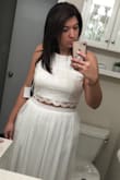 I ordered this two piece for my engagement photo session and I am so happy that I did. The material is heavy and not cheap and looks very elegant. I am usually a size 12 with a smaller waist and larger hips, and this fit me very well. The top runs a little on the large side but is so adjustable that you won't even notice. I definitely recommend! - Jessica W.