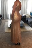 The dress is beautiful and so is the material but I have long torso and the curve the dress has doesn't fit well on me. I recommend it if you are shorter than me. - Barbara A.