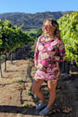 Purchased this dress 2 sizes larger (XL) than my pre-pregnancy size (M) and it was stretchy enough I think only sizing up a size would have been enough. The dress was super comfortable and flattering. The mesh sleeves and neckline are light enough to breathe while also providing sun protection. I wore this to an outdoor summer wedding in Carmel Valley, and it kept me cool and covered. Received SO many compliments on how the dress hugged the bump. Would definitely recommend for mamas in the third trimester. - Jillian P.