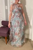 Pretty dress, but the top is way too snug, and I do not consider myself to have a large chest. I couldn't zip it. I would need to size up one size. - Sara C.