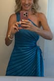 This dress is stunning! Perfect for a destination wedding Aruba. However the fabric is VERY easy to ruin. Just the lotion from my body caused the fabric to darken and stain. I imagine if you think you may sweat, this would be very unsightly. Even a light coat of perfume left dark splotches. - Sarah K.