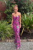 I absolutely love this dress! The colors are so vibrant and sparkly! It does run really long, though, so if you're on the shorter side, you'll probably need to get it hemmed. I'm 5'5 and with my tallest heels, I still needed alterations for the length. Since I wore this to a summer wedding in the south, I also had the material underneath shortened to my knee so there would be more of a breeze coming through the sequin material overlay! - Danielle D.