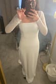 It is a cute dress. A little stretchy but not too much. Color is a truly white color. - Adriana L.
