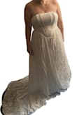 This dress is my dream come true, everything I was looking for in a wedding dress! I briefly tried it on for my wedding next June at an outdoor venue, so excuse my terrible picture. It really doesn't do the dress justice, but for my country romantic whimsical Lord of the Rings themed wedding, this is perfect. Thank you so much. - Stephanie D.