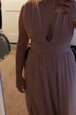 The dress is a lot more pink in person, not at all nude. The shoulders are extremely wide and not especially flattering. The dress is also very long, but can be fixed with a hem. - Clair W.