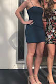 Fit well in all of the right places. I was worried about it being too short, but it fit just fine! The tie top is super cute and helps fit it to every body type. The color was more teal blue looking that teal green but it is a pretty color and worked well for my semi-formal! - Jacey A.