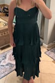 The construction of this dress was totally off. A corset design with no structure whatsoever, unlined on top, fitted at the waist, but with unflattering extra fabric on the upper portion of the dress. It was also uneven, with about an inch of extra fabric on the right side of the chest area vs the left. Overall, it looked saggy and was terrible quality for the price, do not recommend. - Makenzie G.