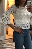 This shirt has such a cool retro vibe. I absolutely adore it, especially the bell sleeves. It's true to size and if worn with a high waist pair of jeans or skirt it's not as cropped as it appears in the picture. It flashes just enough tummy to be versatile, but not so much that you have to be worried about where or what you can wear it with. It runs true to size (I'm a size small, 32C) and it comes with the white cami pictured. My favorite Lulus purchase! - Jasmine C.