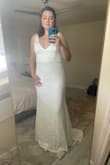 This was my dress for an intimate family wedding, and it was lovely. I had ordered both an L and XL and ultimately went with the XL for comfort around the stomach/hips, although it was a little too big in the chest and straps (I should have gotten it altered). I had no issues with the slip length underneath and wore it with flats, although it would have been long enough to wear with heels, even with my height. It was very comfortable and I loved the back and train! - Amy T.