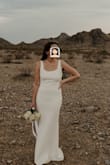 I tried on several dresses from Lulus for our courthouse wedding, and this is the only one I liked. I got a Medium, and it was a little snug in the waist and hips. I would have felt better if I had about a half inch more of fabric on those parts. I wanted the Large and to have it altered, but it was not in stock when I needed it. So, as Tim Gunn would say, "make it work!" I got this dress altered and had the train brought in about 6-8" so it didn't have so much well& train. I also had the shoulder straps shortened by about 1" on both sides as the top was too saggy originally (short torso). This dress is very figure hugging. I wore the Lulus Dorothea Knotted High Heel sandals (3.5" block), and post alteration, the dress skimmed the ground in the front. Perfect length for traipsing through courthouse hallways and the desert. Wore Cakes Bra Cups and Spanx. Measurements: Chest: 35.5" Waist:29" Hips: 38" and I'm 5"6'. LOVED the bow in the back. Many compliments. - Jacinta T.