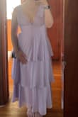 Love this dress! I am freshly postpartum, and sizing is a bit of a challenge for me. What normally would fit me is not fitting lol. I ordered a medium. I was able to zip it shut, but it was VERY tight. I decided to order a large of the same dress and it ended up fitting perfectly. I'm wearing size medium in the picture, though. Felt like it was very flattering! Hides the lower belly pooch I have, but flatters my waist! - Madison H.