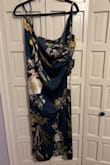 Love the dress color and fits fine, got an XL. Seems cheaply made for price? I would think similar things on Amazon would be around $30-$40.

A little long for my height, but fine. My least favorite thing is the bottom layer that covers one bust is like one short piece? Like the bottom wrap is like a small piece of fabric that moves around odd. Might use dress tape to hold in place. 

Probably would recommend for the price, but it works fine for my occasional, just feel like I paid way too much. - Jennifer S.