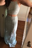 I love this two-piece. I originally ordered it with a bunch of others just for kicks, but I ended up really liking it. The color is beautiful, and the fit is flattering. I may have to hem it, but that's not a big deal. Definitely a solid purchase for prom. - Eliana F.