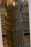 I've been looking for fun, modern, sexy, mother of bride dress.  I'm love with this dress. Perfect fit. Just took a few stitches to close the top a little. Picture is before stitches. Too bad got it before current sale. Would've saved $20 - Evelyn R.