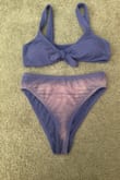 Would not recommend this at all. Nothing was wrong when I received the bathing suit. I washed it and the color was still fine. I wore this bathing suit to a pool for the first time this past weekend, and the bottoms changed color or lost the color. After I got out of the pool, my friend pointed it out to me and so it had to have happened while I was in the water. I wore other bathing suits in the same pool and this did not happen with them. I purchased the matching top, and it did not change color like the bottoms did, and I wore them together. I can't even wear this again and probably won't use the top much either, since it doesn't have the matching bottoms. It was a cute swimsuit otherwise.
Very disappointed with this purchase as I expected much better quality and got only one wear from it. It says that this isn't eligible for a refund so it feels like I wasted a good amount of money. - Hannah S.