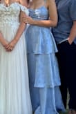 I ordered this dress as a bridesmaid dress, and I loved it! I received many compliments. The quality of the material was good, and it fit great! I typically wear a size 6 or 8. I'm on the taller side and curvier side, so sometimes I'm in between a M and L. I ordered a M, and it fit perfectly. Just a little bit snug in the chest, but I wouldn't have wanted to size up. - Kate S.