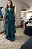 The dress is too long on me. It's a beautiful dress, but I'm going to keep looking on the site. I think I need to order the one that's right below the knee, still has the paper on the shoulders - Lindsey R.