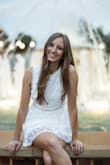Fits well. Very sweet and flattering dress. It is a little itchy. - Chloe B.