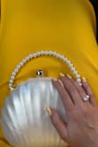 Honestly so unique but still classy. Due to the shape, it was hard to fit some items but this was a beautiful bag and really gave a summer-y, mermaid vibe. - Rebecca S.